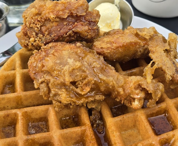 Cafe Genevieve signature dishes Pig Candy (bacon baked with sugar and spices)Fried Chicken and WafflesCajun Eggs Benedict